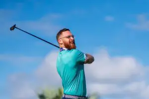 photo of man playing golf