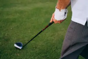 a golfer holding a golf club driver